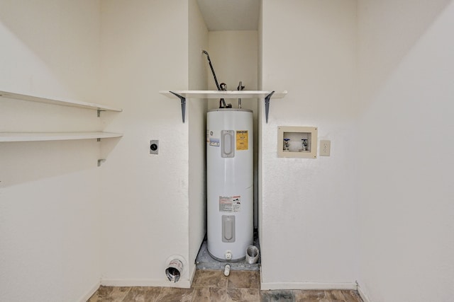 utility room featuring electric water heater