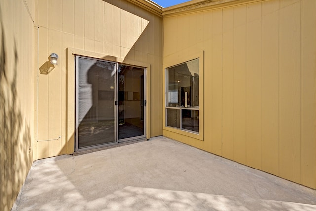 entrance to property featuring a patio area