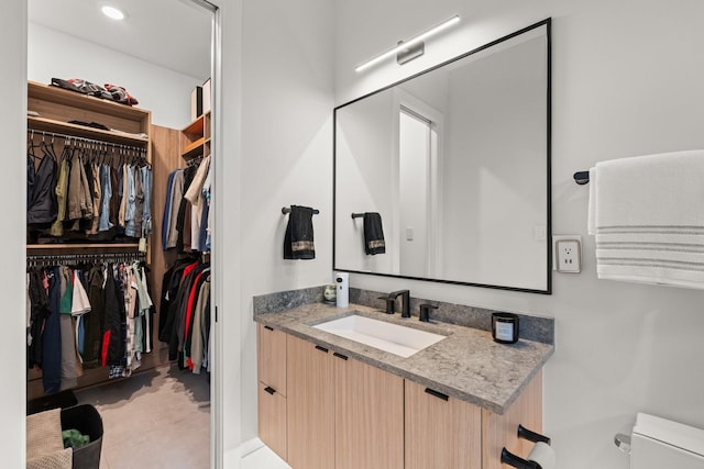 bathroom with vanity and toilet