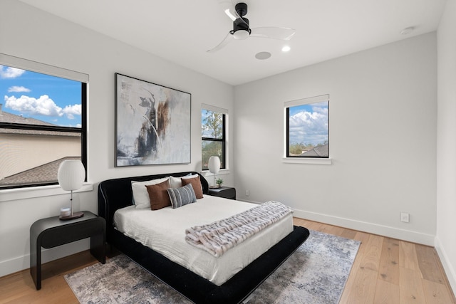 bedroom featuring hardwood / wood-style floors and ceiling fan