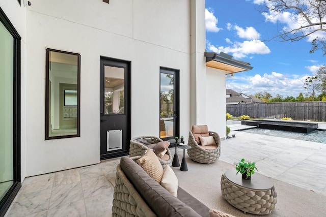 view of patio / terrace with a fenced in pool