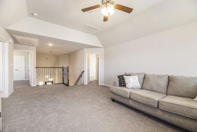 living room featuring lofted ceiling, ceiling fan, and carpet flooring