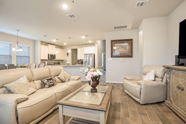 living room featuring a chandelier