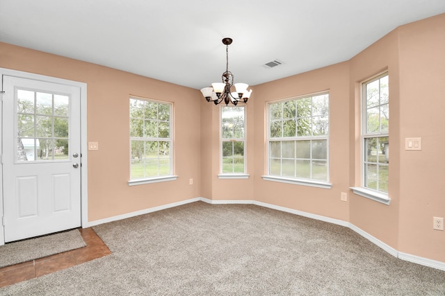 unfurnished dining area with carpet flooring and a wealth of natural light