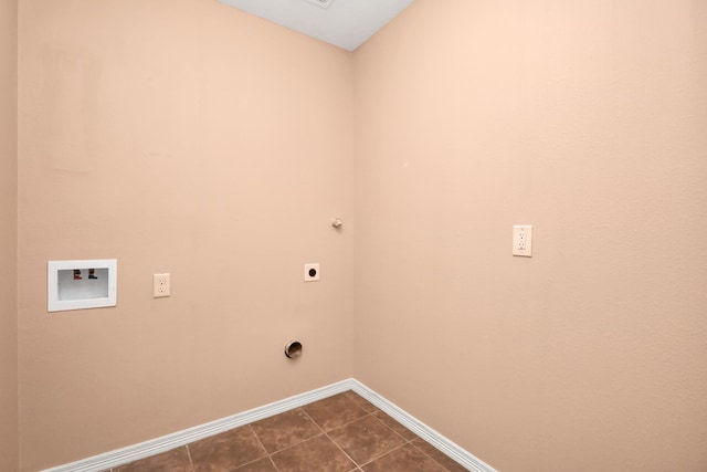 laundry room with washer hookup, dark tile patterned flooring, and hookup for an electric dryer