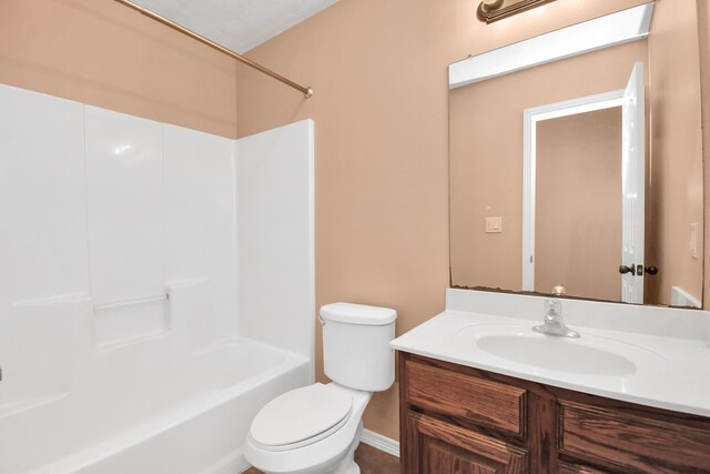 full bathroom with shower / tub combination, vanity, and toilet