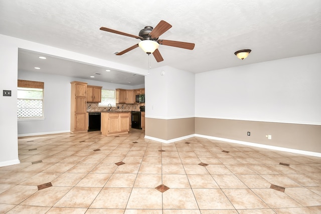 interior space featuring light tile patterned floors, a textured ceiling, ceiling fan, and black appliances