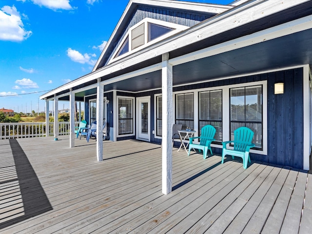 wooden terrace with a porch