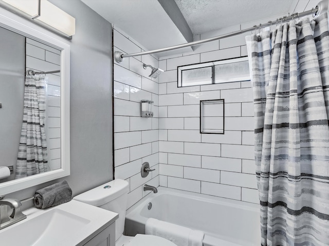 full bathroom featuring vanity, shower / bath combination with curtain, a textured ceiling, and toilet