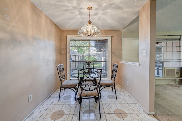 dining space featuring a textured ceiling and an inviting chandelier