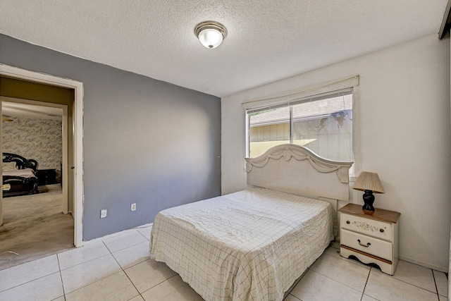 tiled bedroom with a textured ceiling