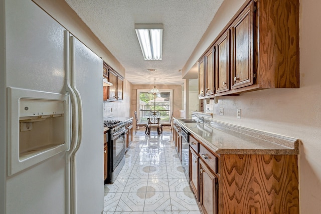 kitchen with white refrigerator with ice dispenser, stainless steel gas range, light tile patterned floors, a textured ceiling, and decorative light fixtures