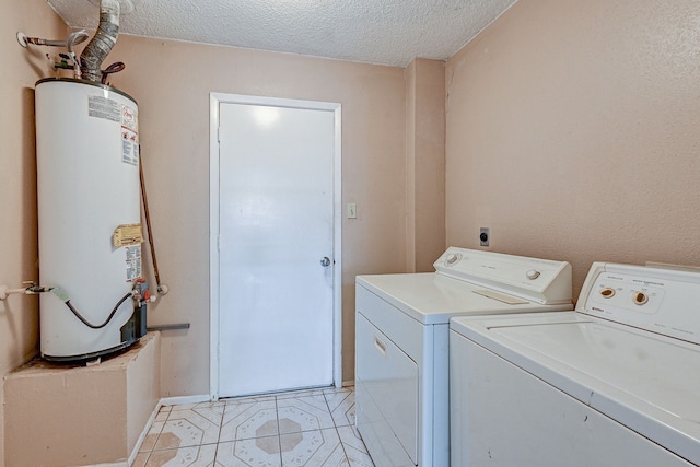 laundry room featuring independent washer and dryer, a textured ceiling, light tile patterned floors, and water heater