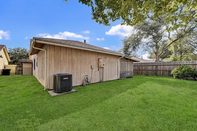 exterior space featuring a yard and central air condition unit