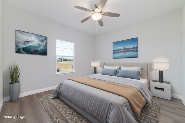 bedroom featuring hardwood / wood-style floors and ceiling fan