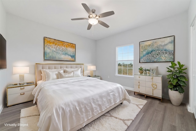 bedroom featuring ceiling fan and wood-type flooring