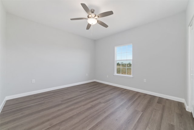 empty room featuring hardwood / wood-style flooring and ceiling fan