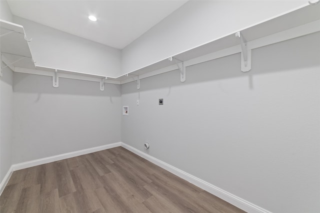 washroom featuring washer hookup, hardwood / wood-style flooring, and electric dryer hookup