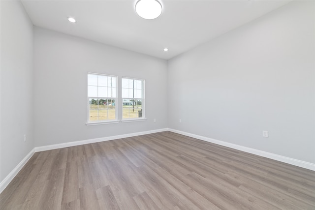 spare room featuring light hardwood / wood-style floors