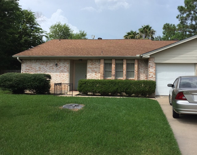 single story home featuring a garage and a front lawn