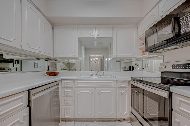 kitchen featuring white cabinetry, appliances with stainless steel finishes, and sink