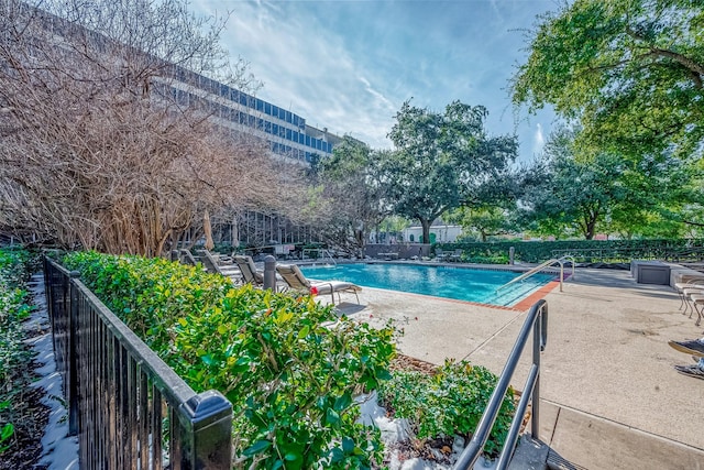 view of swimming pool featuring a patio area