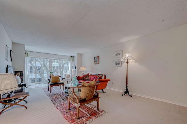 carpeted living room featuring a textured ceiling