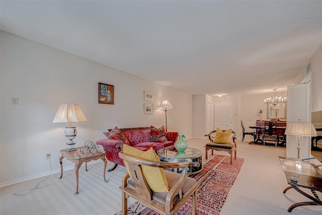 carpeted living room with a textured ceiling and a notable chandelier