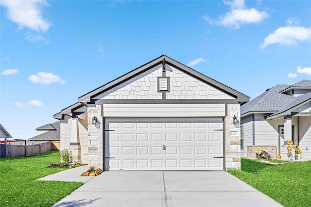 view of front of house with a front yard and a garage