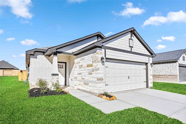 view of front of home with a garage and a front lawn