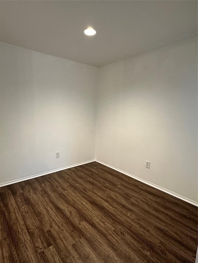 empty room featuring dark hardwood / wood-style floors