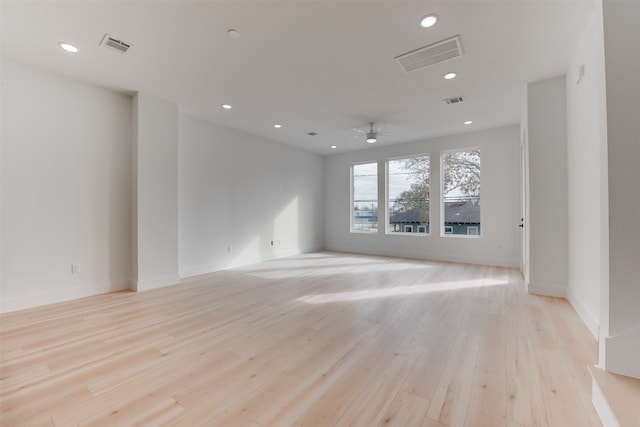 unfurnished room featuring ceiling fan and light hardwood / wood-style floors