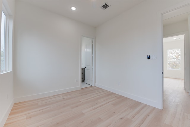 unfurnished room featuring light hardwood / wood-style flooring