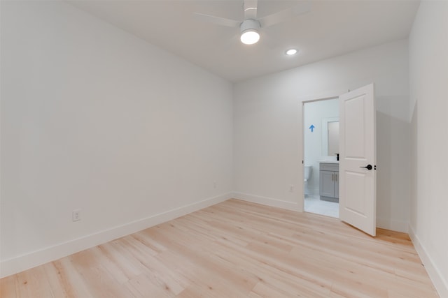 spare room featuring light hardwood / wood-style flooring and ceiling fan