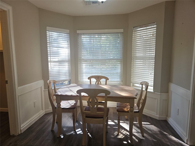 dining room with dark hardwood / wood-style floors