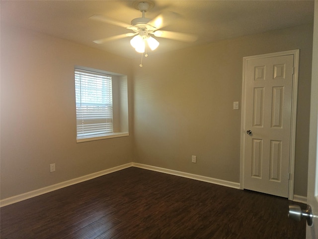 unfurnished room featuring ceiling fan and dark hardwood / wood-style flooring