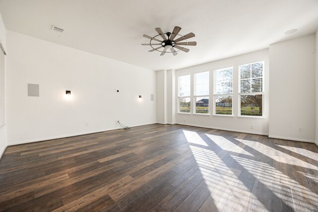 spare room featuring dark hardwood / wood-style floors and ceiling fan