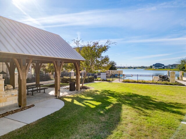 view of yard featuring a gazebo and a water view