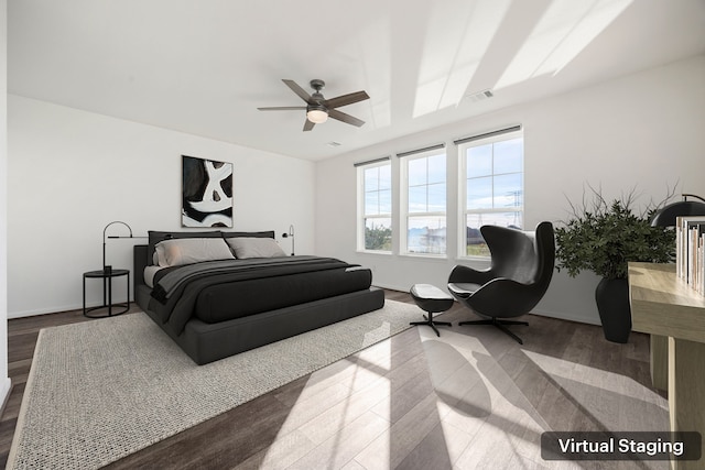 bedroom featuring hardwood / wood-style floors and ceiling fan