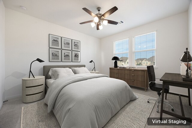 bedroom featuring light colored carpet and ceiling fan