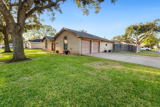 single story home featuring a front yard and a garage