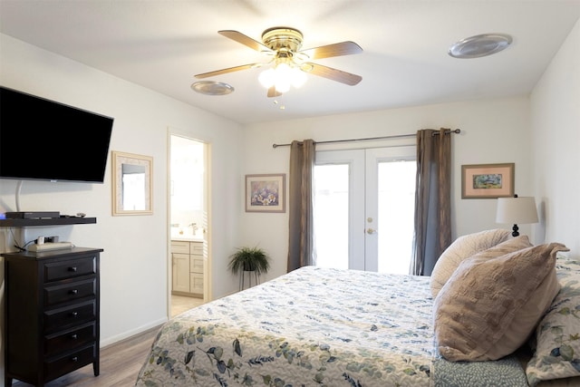 bedroom featuring french doors, light wood-type flooring, ceiling fan, and connected bathroom