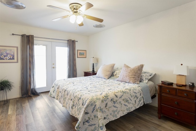 bedroom with french doors, ceiling fan, and dark wood-type flooring