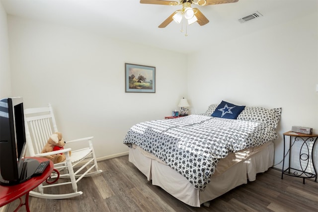 bedroom featuring ceiling fan and dark hardwood / wood-style floors