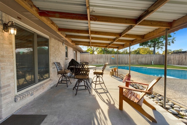 view of swimming pool with a patio area