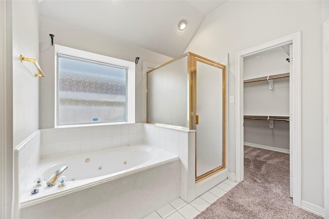 bathroom featuring tile patterned floors, independent shower and bath, and lofted ceiling