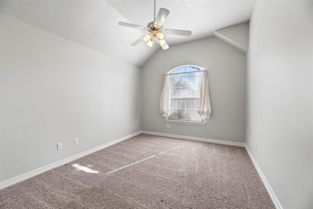 unfurnished room with a textured ceiling, ceiling fan, carpet, and lofted ceiling