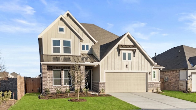 view of front of house featuring a garage and a front yard