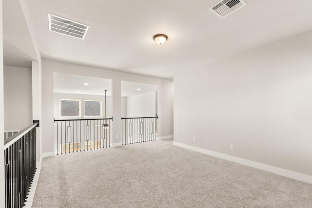 unfurnished room with carpet flooring