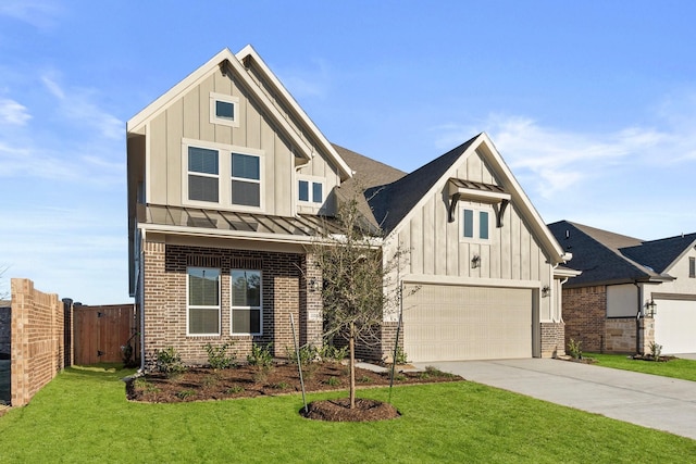 view of front of property with a garage and a front yard